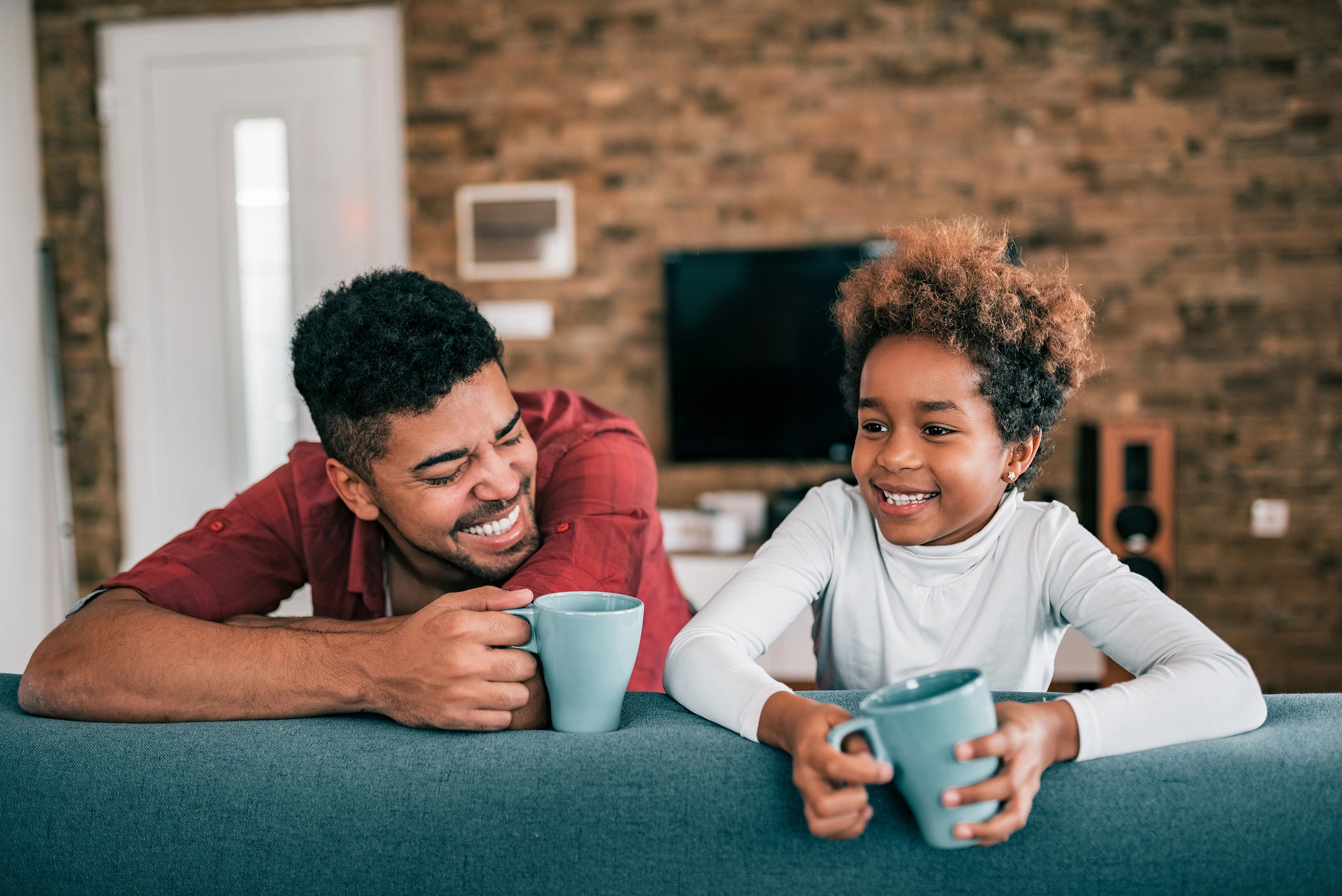Dad kissing baby son’s cheek. Our dedicated divorce attorneys for men fight tirelessly for your best interests as a dad.